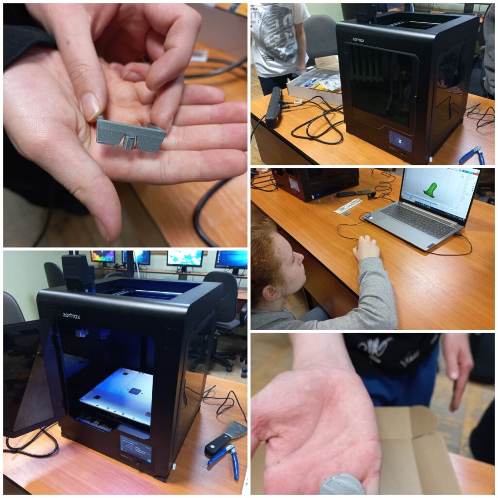 Uczniowie pracują na drukarce 3D